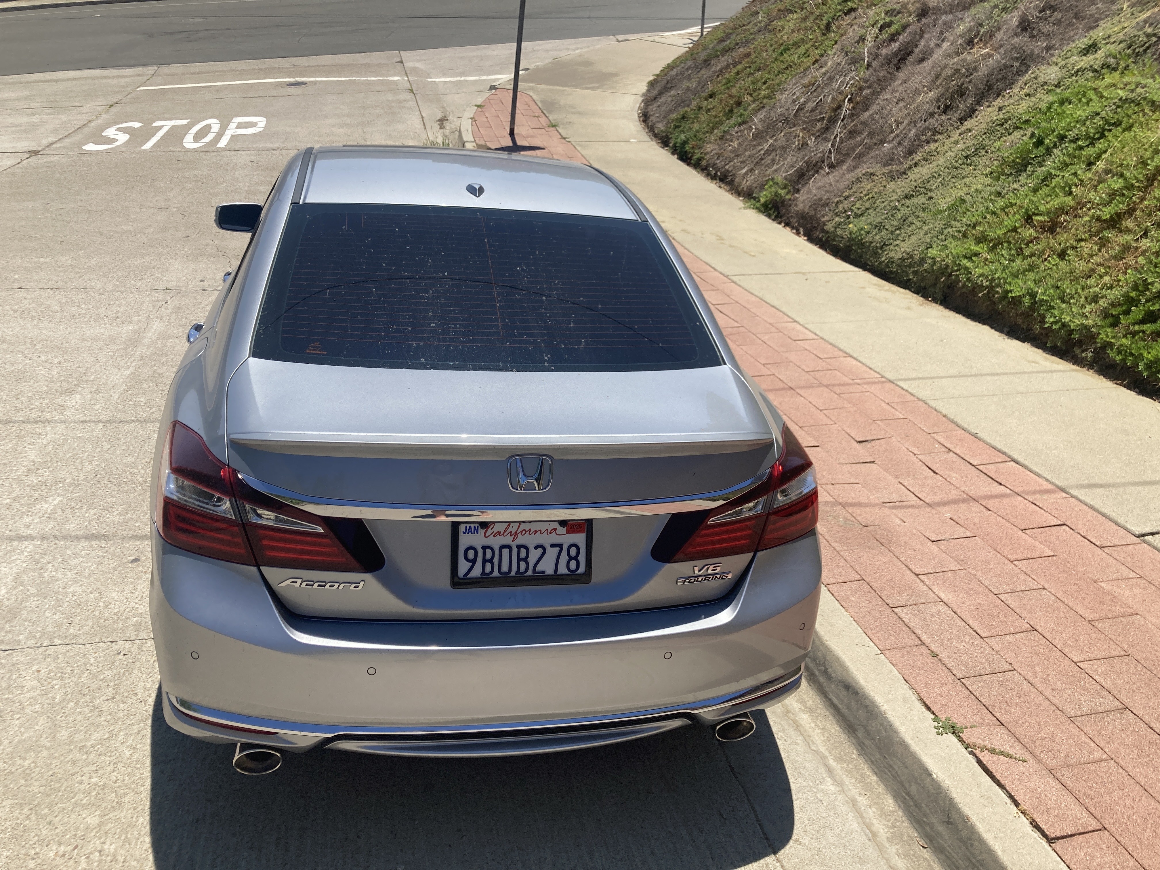 Before — dealer exterior, plate visible